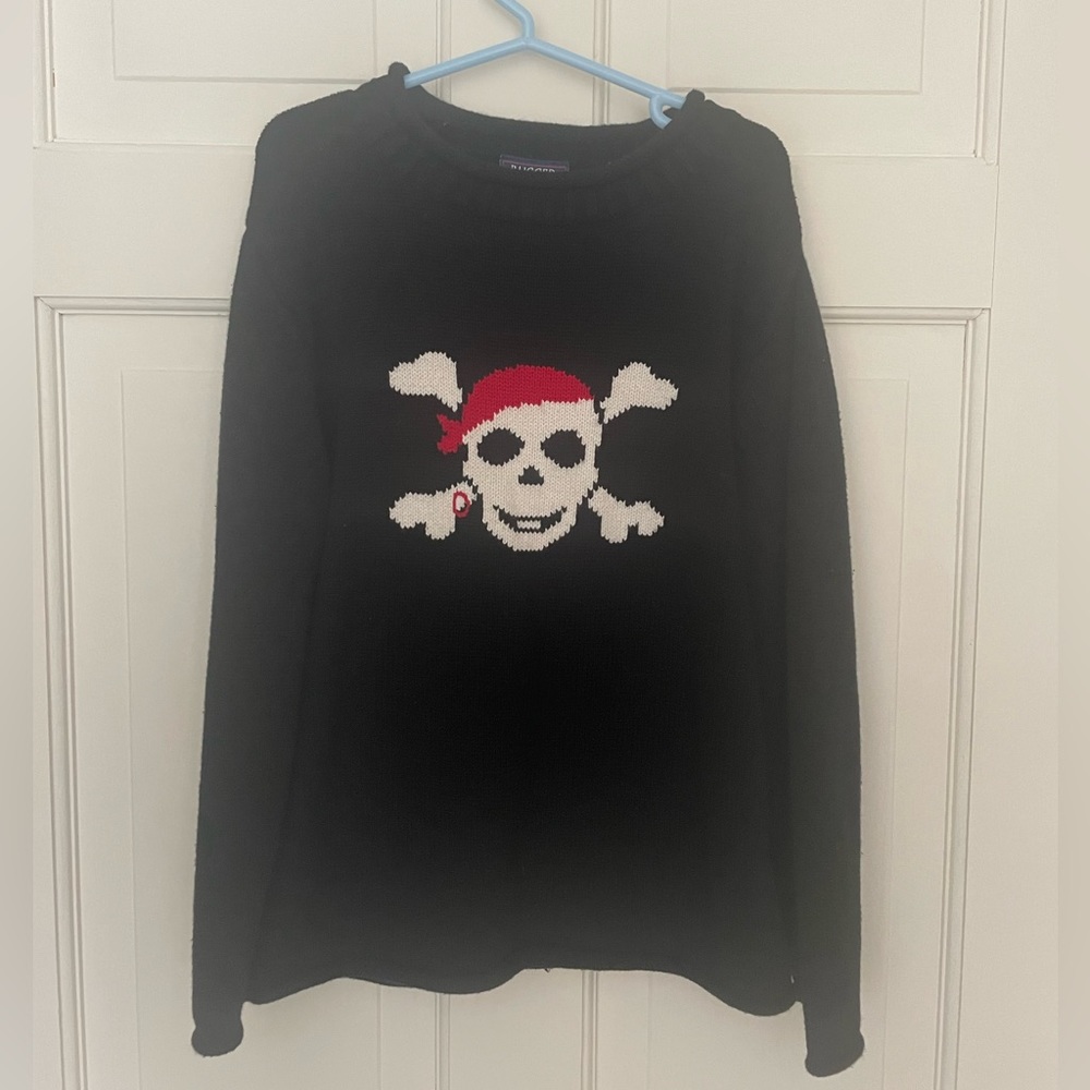 Adorable roll top black skull sweater.